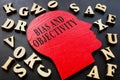 Words bias and objectivity on the head shape and letters. Royalty Free Stock Photo