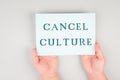 The words cancel culture are standing on a paper, thought control, censorship