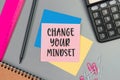 The words Change your Mindset written on a sticky note paper. Closeup of a personal agenda. Top view