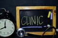 Clinic handwriting on chalkboard on top view Royalty Free Stock Photo