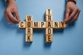 The words company work trade on wooden cubes on a blue background. Royalty Free Stock Photo