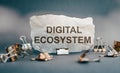 The words digital ecosystem on torn paper Royalty Free Stock Photo