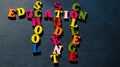 The words Education, School, Student, College built of colorful wooden letters on a dark table. Royalty Free Stock Photo