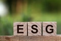 words ESG on a wood block and Future environmental conservation. Royalty Free Stock Photo