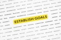 The words `Establish goals` is highlighted with a marker on paper. Business concept, strategy, planning, success. Royalty Free Stock Photo