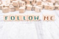 The Words Follow Me Formed By Wooden Blocks On A White Table, Social Media Concept Royalty Free Stock Photo