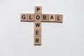 Words of global and power in crossword with wooden cubes Royalty Free Stock Photo