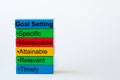 The words: Goal Setting, Specific, Measurable, Attainable, Relevant, Timely are written on colorful blocks Royalty Free Stock Photo