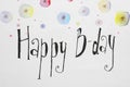 Words HAPPY BIRTHDAY and color flowers pictures on white paper