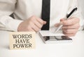 Words Have Power . Notebook on wood table. Idea presentation, analyze plans