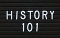 The phrase History 101 in white text on a letter board