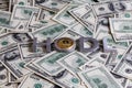 The words HODL laid with aluminium letters and golden bitcoin shiner on dollar banknotes - with selective focus blur Royalty Free Stock Photo