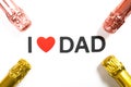 words of I LOVE DAD surrounded by champagnes on a white background Royalty Free Stock Photo