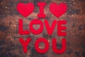 Words I Love You and textile hearts on old wooden background Red textile letters Copy space Royalty Free Stock Photo