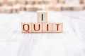 The Words I Quit Formed By Wooden Blocks On A White Table Royalty Free Stock Photo