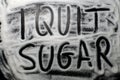 Words I quit sugar written in and with sugar, concept of diet ch