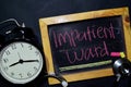 Impatient Ward handwriting on chalkboard on top view. Royalty Free Stock Photo