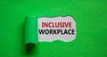 The words `inclusive workplace` appearing behind torn green paper. Beautiful background. Business and better inclusion concept. Royalty Free Stock Photo