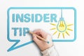 Words INSIDER TIP in speech bubble with glowing light bulb Royalty Free Stock Photo