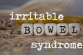 Words IRRITABLE BOWEL SYNDROME composed of wooden dices