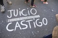 Words Judgment and Punishment painted on the asphalt in Argentina on March 24