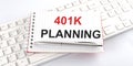 Words 401K PLANNING written on notebook on a computer keyboard Royalty Free Stock Photo
