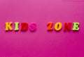 Words `kids zone` on pink background Royalty Free Stock Photo