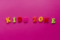 Words `kids zone` on pink background Royalty Free Stock Photo