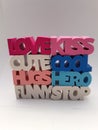 Words love kiss cute cool hugs hero funny stop stacked up on a white background