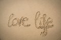 The words love life written in the sand Royalty Free Stock Photo