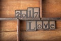The words 2017 Love in wooden typeset.