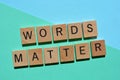 Words Matter, phrase in wooden alphabet letters on turquoise