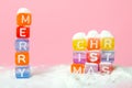 words merry christmas made of colorful blocks on pink background. Flat lay, top view - holidays, winter, christmas and new year ce Royalty Free Stock Photo