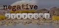 Words NEGATIVE SYMPTOMS composed of wooden dices