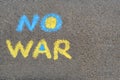 Words No War written with blue and yellow chalks on asphalt outdoors, top view. Space for text Royalty Free Stock Photo