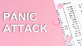 Words PANIC ATTACK on pink background, medical concept, top view