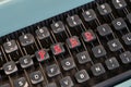 words \'PNRR\' in red on the keys of a vintage typewriter.