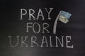Words `Pray for Ukraine` writed on blackboard Royalty Free Stock Photo