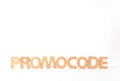 Words Promo Code made of wooden letters on white background