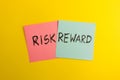 Words risk and reward handwritten on colorful sticky notes Royalty Free Stock Photo