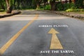 Words of save the earth and green planet on the road at the park Royalty Free Stock Photo