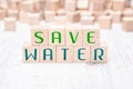 The Words Save Water Formed By Wooden Blocks On A White Table Royalty Free Stock Photo