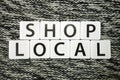 Words shop local on dark background. Domestic business support concept