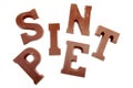 The words SINT and PIET in chocolate letters isolated on white Royalty Free Stock Photo