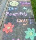 The words "smile, it's a beautiful day"