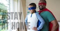 Mixed Race Man And Boy Wearing Capes With Words Stay Home During Coronavirus Covid19 Pandemic