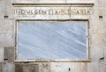 Words on stone. Facade of the cathedral of Modena. Italy