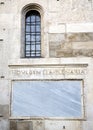 Words on stone. Facade of the cathedral of Modena. Italy