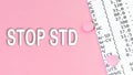 Words STOP STD Sexually transmitted diseases on pink background, medical concept, top view