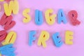 Words Sugar Free on pink table